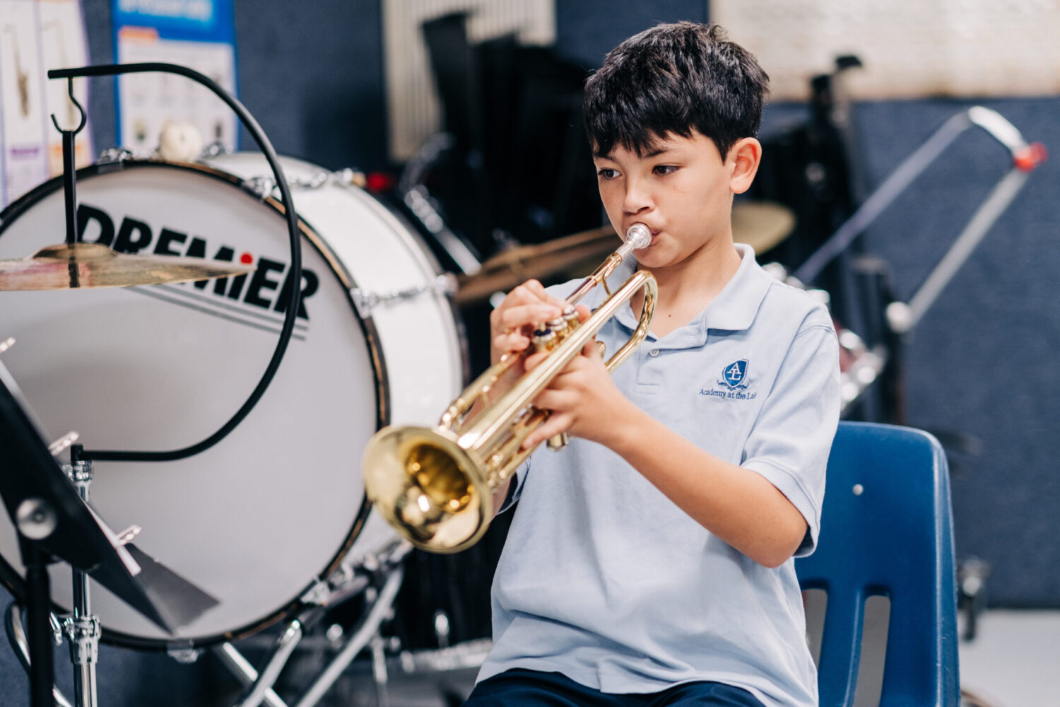 Middle Division student in Fine Arts playing an instrument